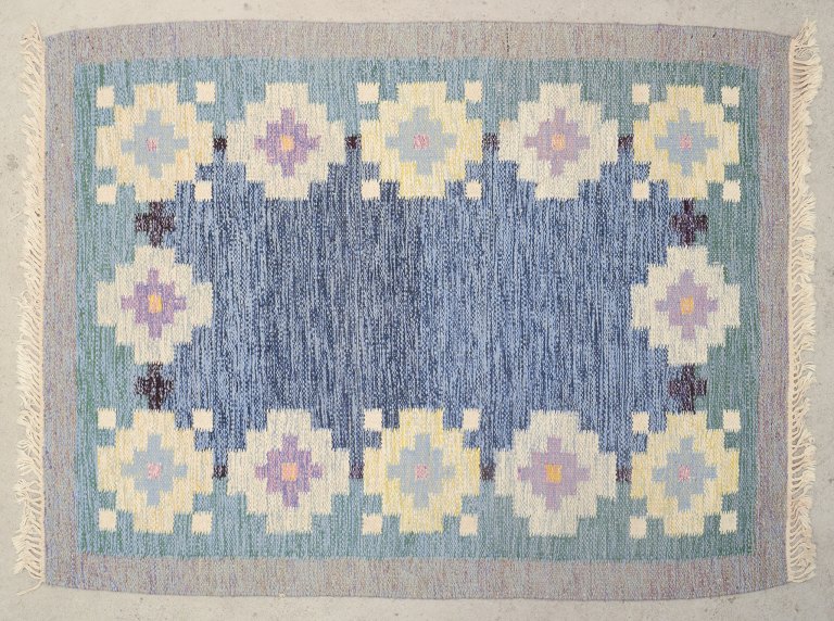 Swedish textile designer.Handwoven rug made of wool. Rölakan technique. Woven with geometric patterns.
