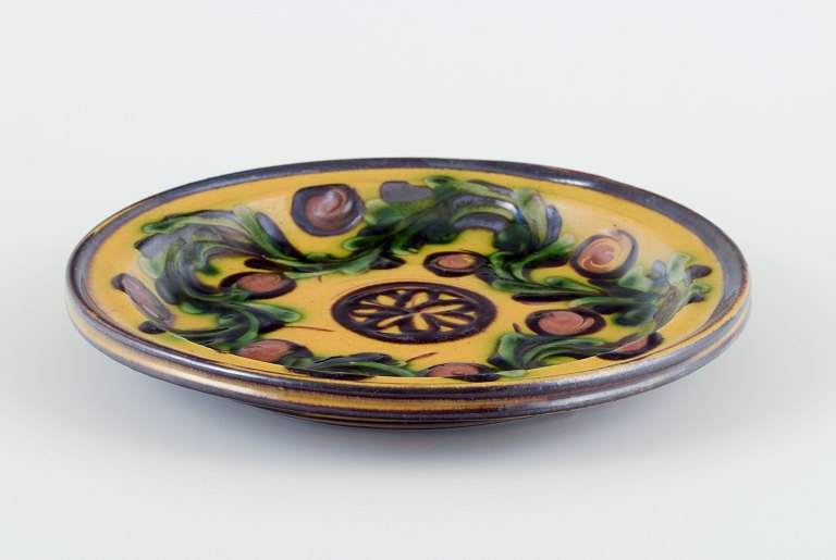 Kähler, Denmark.Dish/wall relief made of ceramic with floral motif.