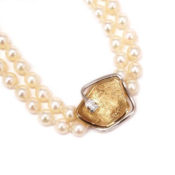 Ole Lynggaard lås til dobbeltradet halskæde i 14kt guld med brillant på ca. 0,1ct. Mål: 20x20mm
