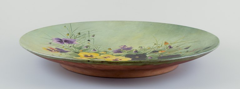Eva Jancke-Björk (1882–1981) for Rörstrand, Sweden. Colossal wall plaque made of chamotte clay.Hand-painted with floral motif.