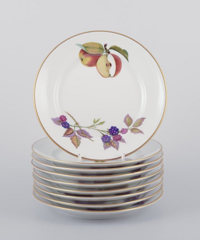 Royal Worcester, England.A set of nine Evesham porcelain plates decorated with fruit and gold trim.