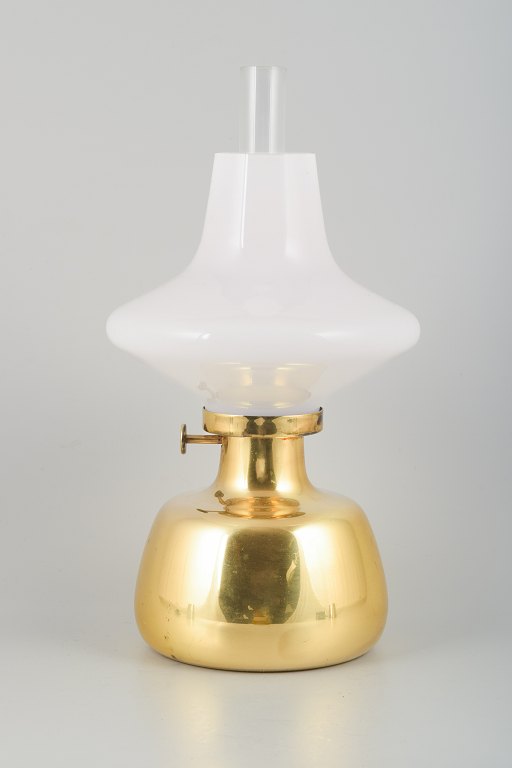 Henning Koppel for Louis Poulsen.Petronella oil lamp in brass with an opal glass shade.