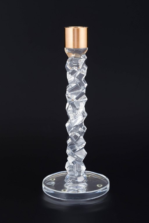 Orrefors, SwedenCandleholder in clear crystal with faceted, sculptural shaft and brass candleholder.