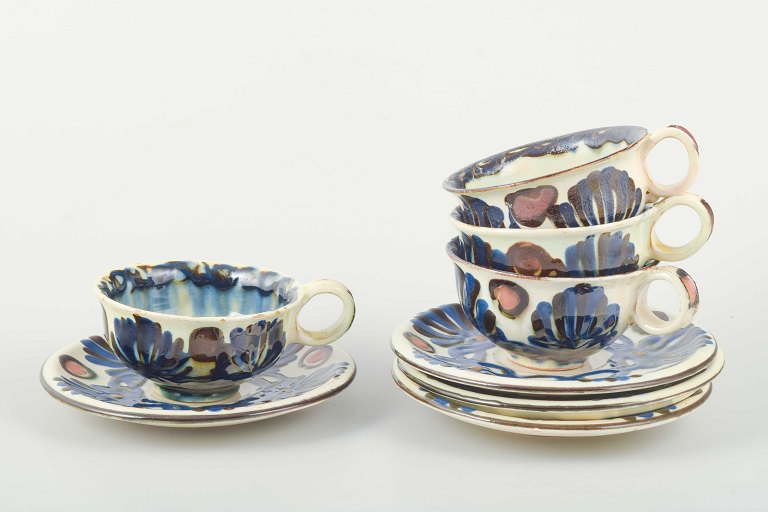 Kähler, DenmarkSet of four teacups with matching saucers from the Marguerite service.