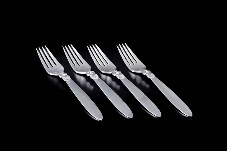 Georg JensenFour large dinner forks in the “Cactus” pattern.Sterling silver.