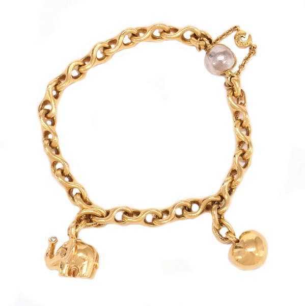 Ole Lynggaard 8-tals armlænke i 14kt guld med charms i form af elefant og hjerte. Kuglelås delvist hvidguld. Ledstr. 7x13mm