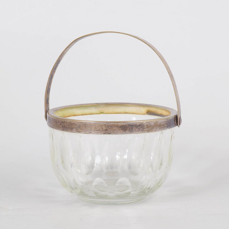 Glass sugar bowl with silver-plated handle.