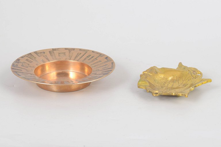 Two brass bowls.