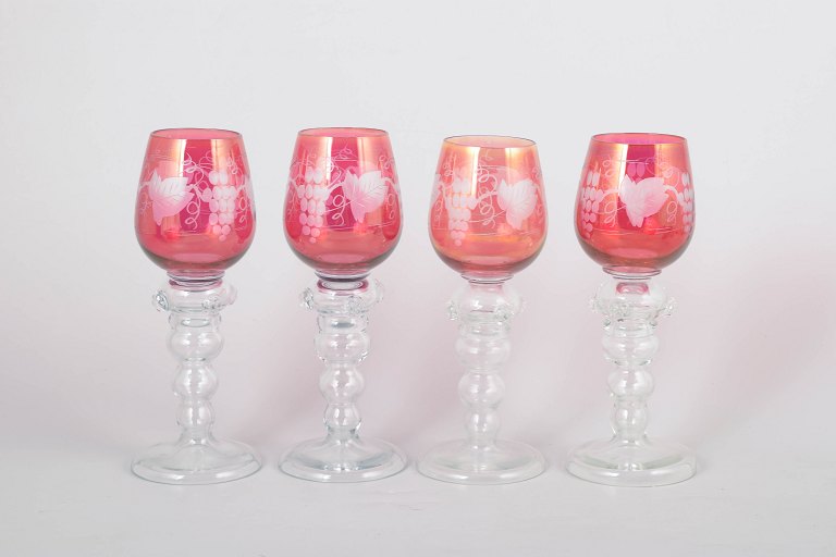 Set of four Bohemian red wine glasses.