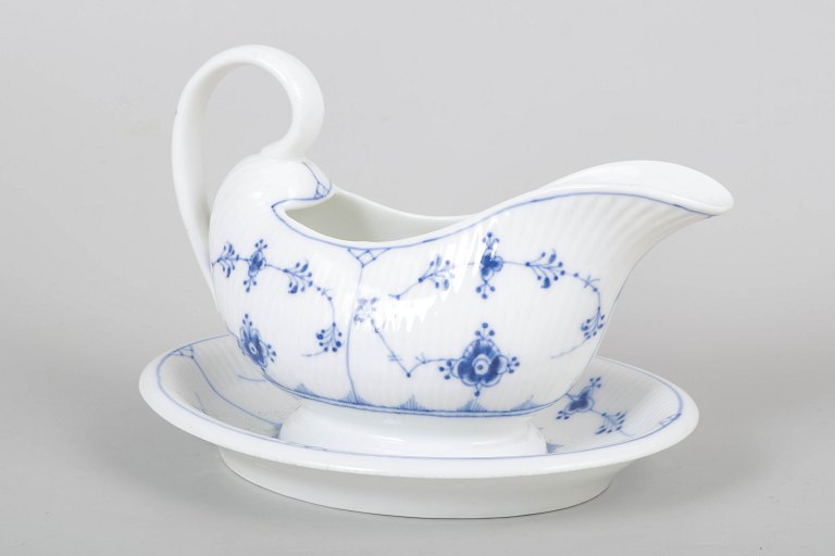 Royal Copenhagen Blue Fluted Plain sauce boat with attached stand.