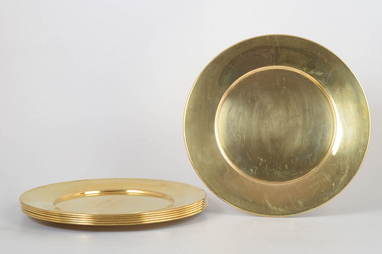 Set of six brass charger plates, 1970s.